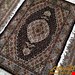 اندازه ذرع و نیم 1.5 متری 40 رج با پشم مرغویب ایرانی تک گره ترکی (تضمینی) رنگ متن سرمه ای حاشیه افسری و ترنج کرم 7 متن رنگی 28 رنگ پشم و 1 رنگ ابریشم جدیدترین نقشه ماهی کمال الملک خوی رنگرزی شده بصورت سنتی تضمین کیفیت بافت همراه با قید در فاکتور  