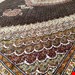 اندازه جفت 9 متری 40 رج با پشم مرینوس پرویزیان (7لا) طرح گل 50 رج تک گره ترکی (تضمینی) رنگ متن سرمه ای، حاشیه افسری و ترنج پیازی 15 متن رنگی 28 رنگ پشم و 3 رنگ ابریشم جدیدترین نقشه ماهی کمال الملک خوی رنگرزی شده توسط دستگاه اشلاپ فورس با پودر صیبای آلمانی تضمین کیفیت بافت همراه با قید در فاکتور