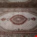  اندازه جفت 6 متری 40 رج با پشم مرینوس پرویزیان (7لا) طرح گل 50 رج تک گره ترکی (تضمینی) رنگ متن کرم، حاشیه افسری و ترنج پیازی 13 متن رنگی 28 رنگ پشم و 3 رنگ ابریشم جدیدترین نقشه ماهی کمال الملک خوی رنگرزی شده توسط دستگاه اشلاپ فورس با پودر صیبای آلمانی تضمین کیفیت بافت همراه با قید در فاکتو                